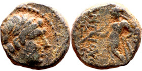 Antiochos III The Great (Seleukid King: 223-187 BC). AE bronze. Obv.: Laureate head of Apollo Rev.: Apollo seated left on omphalos, testing arrow and ...