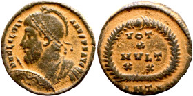 Julian II Apostate (361-363) Follis. Obverse: DN FL CL IVLIANVS PF AVG, Helmeted and cuirassed bust left, holding spear and shield Reverse: VOT X MVLT...