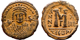Maurice Tiberius (582-602) Follis. Antioch. Obverse: Crowned bust facing, wearing consular robes, holding mappa and eagle-tipped scepter , Reverse: La...