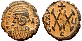 Maurice Tiberius (582-602) Half Follis. Antioch. Obverse: Crowned bust facing, wearing consular robes, holding mappa and eagle-tipped scepte Reverse: ...