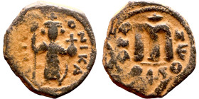 Constans II (641-668) Follis. Obverse: Imperial figure holding cross and globus Reverse: m and inscription