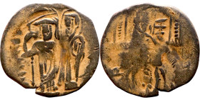 Uncertain XII-XIII trachy. Obv: Unredable. Rev: Emperor on the left, holding labarum and cross on globe, being crowned by Mary, both standing facing