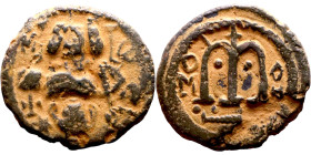 al-Malik ibn Marwan (687-705), Constans II style folis Obverse: Imperial figure holding globus Reverse: m and inscription