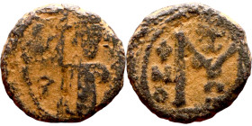 al-Malik ibn Marwan (687-705), Constans II style folis Obverse: Imperial figure holding globus Reverse: m and inscription