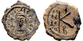 Maurice Tiberius (582-602) Half Follis. Obverse: Helmeted and cuirassed bust facing, holding globus cruciger and shield., Reverse: Large K above cross...