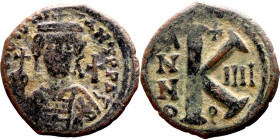 Maurice Tiberius (582-602) Half Follis. Obverse: Helmeted and cuirassed bust facing, holding globus cruciger and shield., Reverse: Large K above cross...