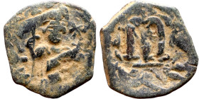 Constans II (641-668) Follis. Obverse: Imperial figure holding cross and globus Reverse: m and inscription