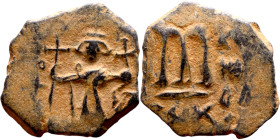 Constans II (641-668) Follis. Obverse: Imperial figure holding cross and globus Reverse: m and inscription