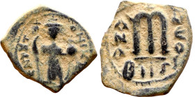Constans II (641-668) Follis. Obverse: Imperial figure holding cross and globus Reverse: m and inscription