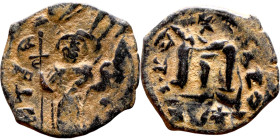 Constans II (641-668) Follis. Obverse: Imperial figure holding cross and globus Reverse: m and inscription