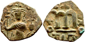 Constans II (641-668) Follis. Obverse: Imperial figure holding cross and globus Reverse: m and inscription