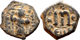 Constans II (641-668) Follis. Obverse: Imperial figure holding cross and globus Reverse: m and inscription