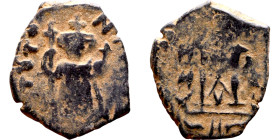 Constans II (641-668) Follis. Obverse: Imperial figure holding cross and globus Reverse: m and inscription