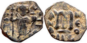 Constans II (641-668) Follis. Obverse: Imperial figure holding cross and globus Reverse: m and inscription