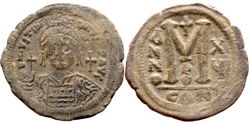 Justinian I (527-656) Follis. Obverse: DN IVSTINIANVS PP AVG, Armoured facing bu...