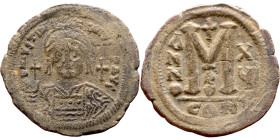 Justinian I (527-656) Follis. Obverse: DN IVSTINIANVS PP AVG, Armoured facing bust holding globus Reverse: Large M between ANNO and regnal year