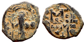 Constans II (641-668) Follis. Obverse: Imperial figure holding cross and globus Reverse: m and inscription