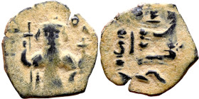 al-Malik ibn Marwan (687-705), Constans II style folis Obverse: Imperial figure holding globus Reverse: m and inscription