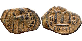 Constans II (641-668) Follis. Obverse: Imperial figure holding cross and globus Reverse: m and inscription
