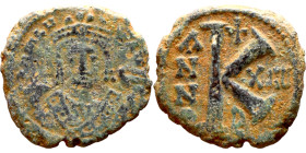 Maurice Tiberius (582-602) Half Follis. Antioch. Obverse: Crowned bust facing, wearing consular robes, holding mappa and eagle-tipped scepter , Revers...