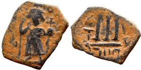 Constans II (641-668) Follis. Obverse: Imperial figure holding cross and globus Reverse: m and inscription