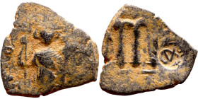 Constans II (641-668) Follis. Obverse: Imperial figure holding cross and globus Reverse: m and inscription