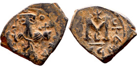 Constans II (641-668) Follis. Obverse: Imperial figure holding cross and globus Reverse: m and inscription
