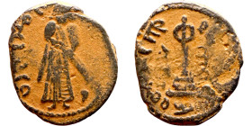 al-Malik ibn Marwan (687-705) Follis. Obverse: Imperial figure. Reverse: Modified cross potent set on steps
