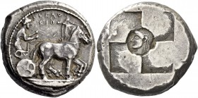 Syracuse. Tetradrachm circa 510-490, AR 17.22 g. SVRAKO / ΣION Slow quadriga driven r. by clean-shaven charioteer, wearing long chiton and holding rei...