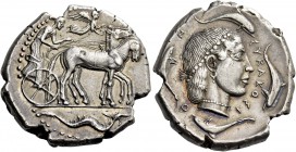 Syracuse. Tetradrachm circa 460-440, AR 17.36 g. Slow quadriga driven r. by charioteer, holding kentron and reins; above, Nike flying r. to crown hors...