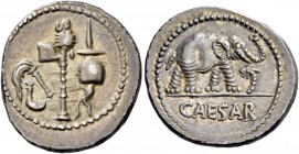 C. Iulius Caesar. Denarius, mint moving with Caesar 49-48, AR 3.95 g. Pontifical emblems: culullus, aspergillum, axe and apex. Rev. Elephant r., tramp...