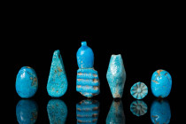 SET OF EGYPTIAN BLUE FAIENCE PENDANTS AND AMULETS
