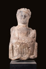 CYPRIOT STONE VOTIVE FIGURE OF A GODDESS ON A THRONE