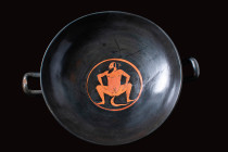 ATTIC RED-FIGURE KYLIX WITH CENTRAL SATYR