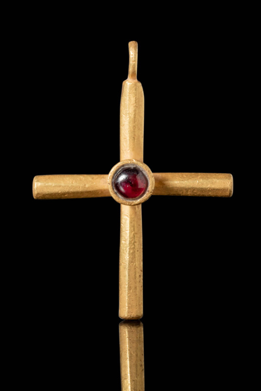 BYZANTINE GOLD CROSS PENDANT WITH CENTRAL RED GARNET

Ca. AD 600 - 700. A gold...
