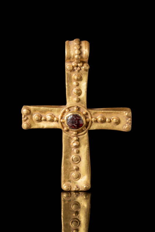 BYZANTINE GOLD GOLD CROSS WITH CENTRA RED GARNET CABOCHON

Ca. AD 600 - 900. A...