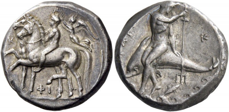 Calabria, Tarentum. Nomos circa 340-335, AR 7.84 g. Naked ephebos, crowned by Ni...