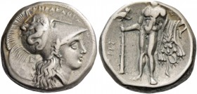 Lucania, Heraclea. Nomos circa 281-278, AR 7.83 g. Helmeted head of Athena r., bowl decorated with Scylla hurling stone; behind neck-guard, E. Rev. He...