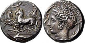 Syracuse. Tetradrachm signed by Eukleidas circa 405-400, AR 17.17 g. Fast quadriga driven l. by chiton-clad charioteer, holding kentron and reins; abo...