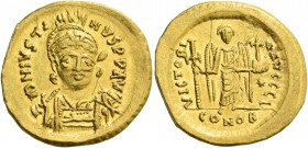 Justin I, 10 July 518 – 1 August 527. Solidus circa 519–527, AV 4.47 g. Helmeted, pearl-diademed and cuirassed bust three-quarters facing, holding spe...