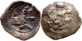 Lycaonia: Laranda (IV- III century BV) Obol. Obv:Baaltars seated left, holding grain ear, grape bunch, and scepter. Rev: Forepart of wolf right;