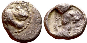 Lycaonia: Laranda (IV- III century BV) Obol. Obv:Baaltars seated left, holding grain ear, grape bunch, and scepter. Rev: Forepart of wolf right;