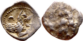 Lycaonia: Laranda (IV- III century BV) Obol. Obv:Baaltars seated left, holding grain ear, grape bunch, and scepter. Rev: Forepart of wolf right;