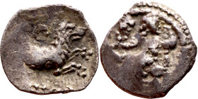 Lycaonia: Laranda (IV- III century BV) Obol. Obv:Baaltars seated left, holding grain ear, grape bunch, and scepter. Rev: Forepart of wolf right;