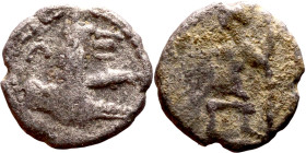 Lycaonia: Laranda (IV- III century BV) Obol. Obv:Baaltars seated left, holding grain ear, grape bunch, and scepter. Rev: Forepart of wolf right;