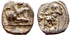 Lycaonia: Laranda (IV- III century BV) Obol. Obv:Baaltars seated left, holding grain ear, grape bunch, and scepter. Rev: Forepart of wolf right;