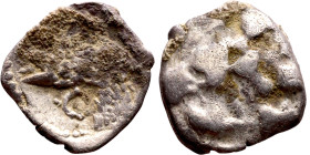 Lycaonia: Laranda (IV- III century BV) Obol. Obv:Baaltars seated left, holding grain ear, grape bunch, and scepter. Rev: Forepart of wolf right;