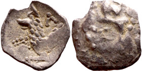 Lycaonia: Laranda (IV- III century BV) Obol. Obv:Baaltars seated left, holding grain ear, grape bunch, and scepter. Rev: Forepart of wolf right;