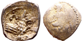 Lycaonia: Laranda (IV- III century BV) Obol. Obv:Baaltars seated left, holding grain ear, grape bunch, and scepter. Rev: Forepart of wolf right;