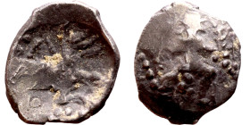 Lycaonia: Laranda (IV- III century BV) Obol. Obv:Baaltars seated left, holding grain ear, grape bunch, and scepter. Rev: Forepart of wolf right;